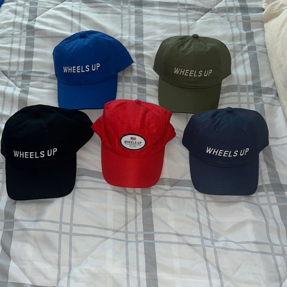 Wheels Up Aviation hats in multiple colors
